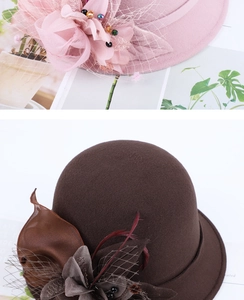Detail of wool felt pillbox hat featuring mesh veil and handmade fabric flower decoration