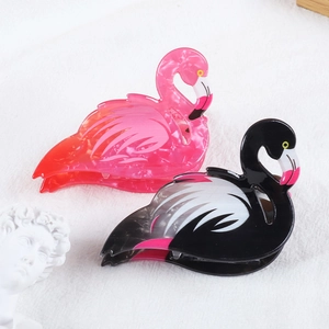 Cute flamingo hair claw clips in pink and black marble acrylic for elegant hair styling