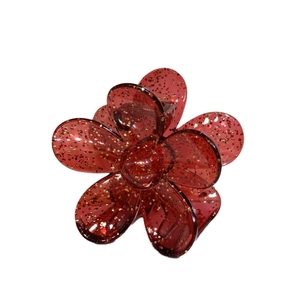 Sparkling transparent red flower hair claw clip with golden glitter details for women