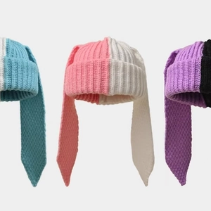 Three pairs of knitted hats with long rabbit ears in blue, pink, and purple color splicing