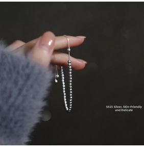 Detail of adjustable S925 sterling silver beaded bracelet with polished round beads