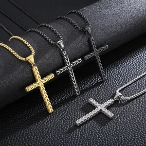 Three men's stainless steel cross necklaces with wheat pattern on black leather background