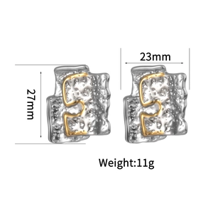 Modern two-tone irregular textured stainless steel earrings with 27mm height measurement