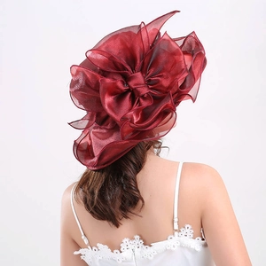 Close-up of elegant burgundy organza sun hat featuring multilayered bowknot detail