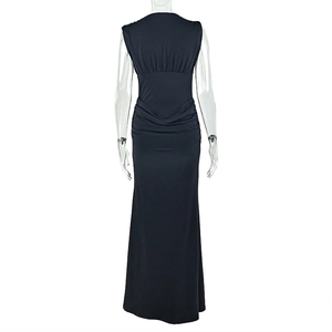 Detail of the back view of a black bodycon dress with ruching on a transparent mannequin