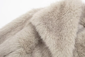 Macro shot showcasing the soft texture and dense fibers of premium light grey faux fur