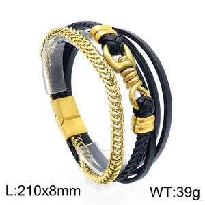 Detail view of multi-layer black woven leather and gold metal chain bracelet with magnetic clasp