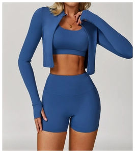 Detailed blue three-piece yoga set showing thumb holes on jacket and high waist shorts