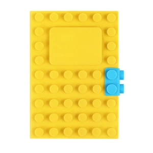 Detail of yellow silicone building block notebook with a blue toy-style brick buckle