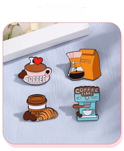 Set of 4 coffee-themed enamel pins featuring coffee pots and cups on a blue fabric background
