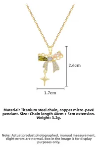 Detailed macro of butterfly necklace with pink green gems and star pendant