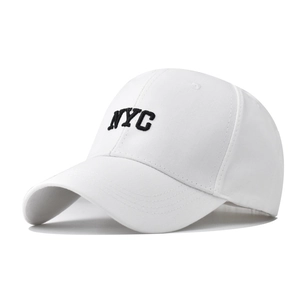 Detailed view of the black NYC embroidery on a white cotton baseball cap with high precision