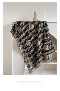 Close-up of rose pattern cashmere-feel scarf with elegant tassel fringe details