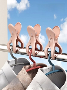 Pink plastic heavy-duty windproof clothespins with wide jaw grip and metal springs