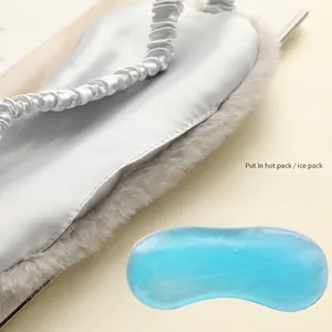 Plush silk blackout sleep mask with blue gel cooling pad for hot and cold eye therapy