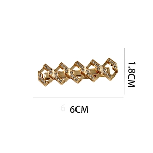 Detail view of gold alloy hair clip with diamond rhombus design and size measurements