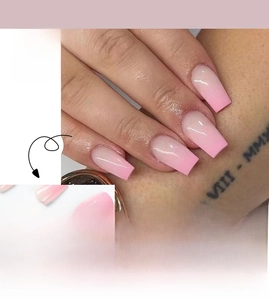 Detail of pink gradient ballet press-on nails with high gloss finish and ombre effect