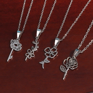 Detail showing four silver stainless steel necklaces with various hollow floral pendants