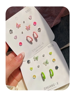 Detailed view of S925 silver stud earring set with butterfly and flower motifs