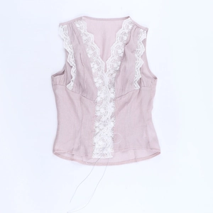 Detail of lavender lace-trimmed V-neck tank top with delicate drawstring and floral edges