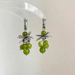 Silver flower C-shaped earrings with green crystal grape tassels and polished finish