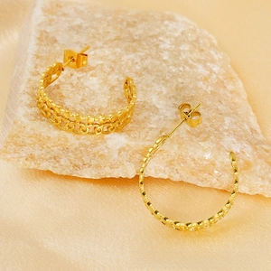 Detail of 18K gold-plated double-layer hoop earrings with bead and chain design elements
