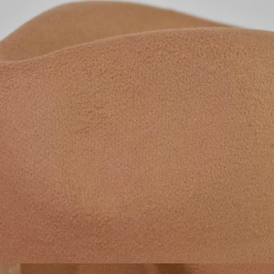Close-up detail of thick camel wool felt material showing fine texture on flat top hat