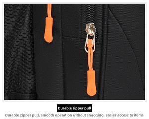 Detail of durable black fabric with orange zipper pull and breathable mesh panel