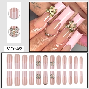 French press-on nails with 3D bows, pink tips, and rhinestones in long square shape