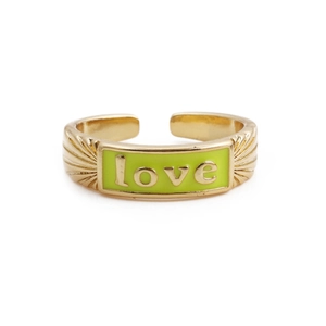 Detail of adjustable gold ring featuring green enamel block with LOVE lettering