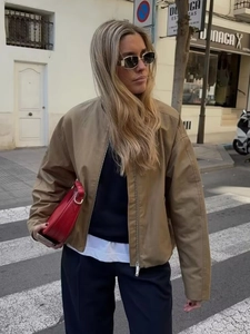 Minimalist khaki bomber jacket for women featuring loose fit and silver zipper in street style