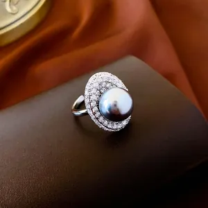 Luxury oval dark grey pearl ring with double pave zircon halo in polished silver setting