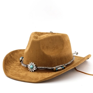 Detail of brown suede cowboy hat with turquoise bead band and sunflower metal ornament