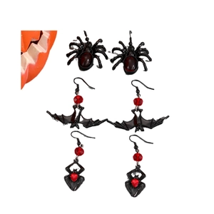 Halloween earring set featuring black spider, bat, and skull designs with red gems
