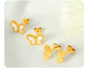 Close-up of butterfly stud earrings with 18k gold plating and mother-of-pearl inlay details