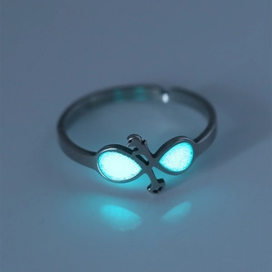 Detailed macro of a glowing infinity anchor ring in polished stainless steel for women