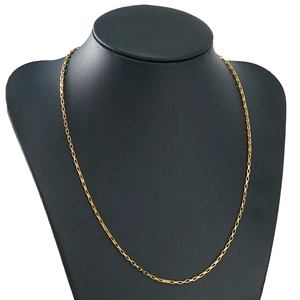 Elegant gold stainless steel box chain necklace displayed on a professional black bust