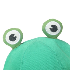 Close-up of green frog bucket hat with 3D stuffed eyes and detailed embroidery