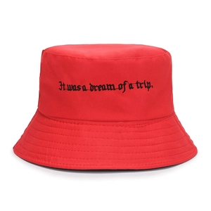 Red canvas bucket hat with black Gothic embroidery and reinforced brim stitching