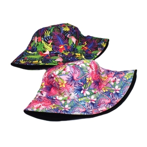 Reversible bucket hat with flamingo and tropical floral print for sun protection