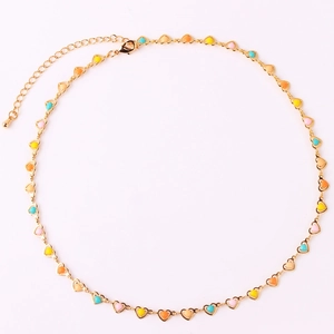 Close-up of gold chain featuring colorful enamel heart charms and adjustable lobster clasp