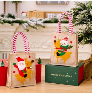 Detail of Christmas burlap gift bags featuring 3D Santa and snowman appliques