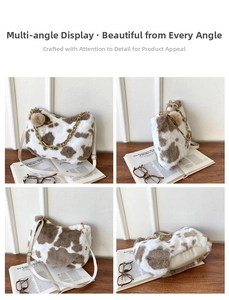 Detail view of cow print faux fur tote bag with gold chain and white PU leather strap