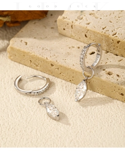 Macro shot of S925 sterling silver stamp on pear-shaped moissanite drop earrings