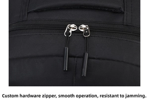 Detail of durable dual metal zippers and high-density black oxford fabric on backpack