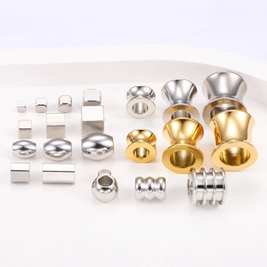 Golden and silver stainless steel beads in various geometric shapes for DIY jewelry making