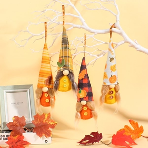 Set of four autumn harvest gnomes hanging decorations with colorful fall patterns