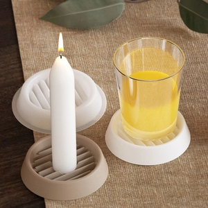 Close-up of ribbed silicone coasters used as candle bases and glass drink mats