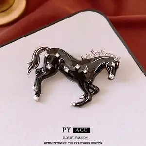 Vintage Chinese style horse brooch in black enamel and sparkling white crystals