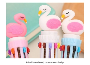Macro detail of cartoon swan silicone charm and multi-color switch mechanism on pen